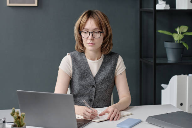 istock Relaxed Woman Sitting at Table 2189897619