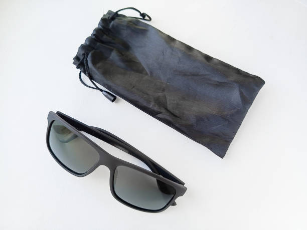 istock Sunglasses and a case for storing glasses on a white table. 2189897726