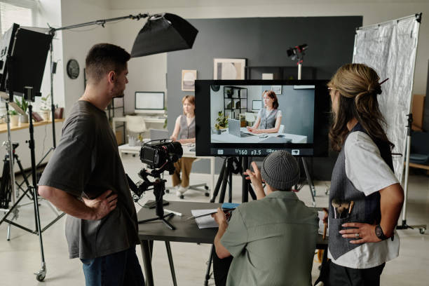 istock Director and Assistants Watching Footage 2189898666