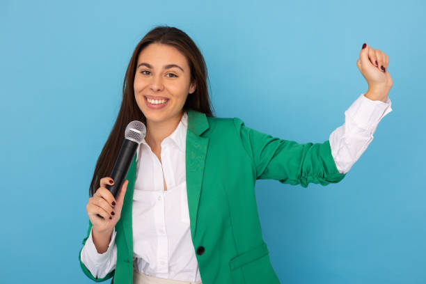 istock Confident young Latina woman holding a microphone 2189898868