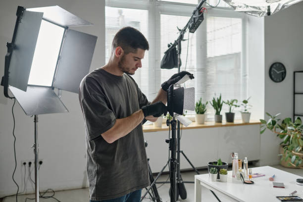 istock Man Repairing Lamp 2189899425