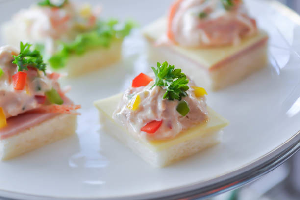istock canape or toast with ham , cheese , tuna and corn 2189899813