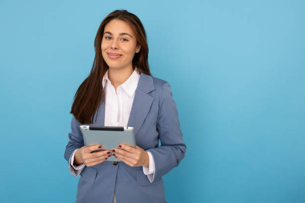 istock Portrait of a confident Latina woman using a tablet 2189900124