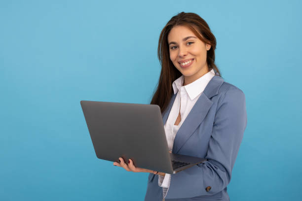 istock Focused young woman working on her laptop 2189900140