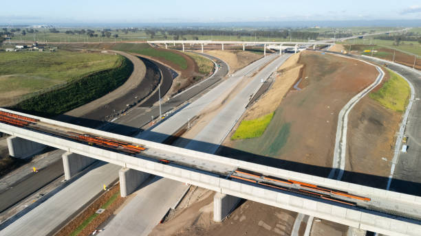 istock Low aerial drone view of the M12 motorway connection interchange construction site for the new Western Sydney Airport at Badgerys Creek in Western Sydney, NSW 2189900390