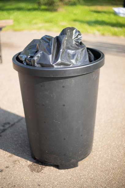 istock An outdoor waste bucket. Black waste bag. Waste container. 2189900986