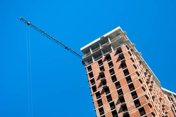 istock Construction site with crane against the blue sky. Construction of a multi-storey building 2189905173
