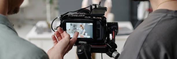 istock Header with Unrecognizable Members of Crew Discussing Footage 2189905635
