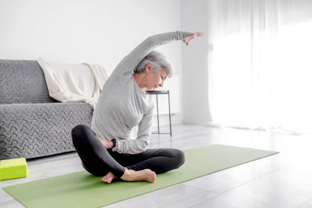 istock Pleasant 65-Year-Old Woman Exercises 2189905644