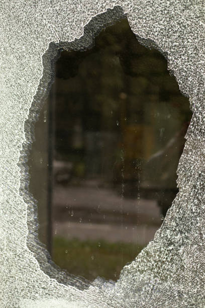 Broken glass. Cracked glass. Spoilt shop window. Lots of shards.