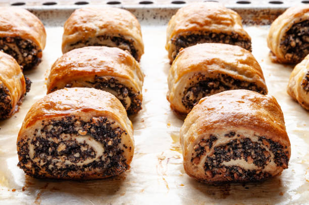 istock Crispy freshly baked cookies with poppy seeds on a baking tray. 2189906467