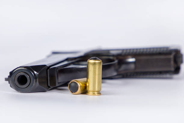 Pistol and traumatic bullets. Self defense weapon. Focus on the tip.