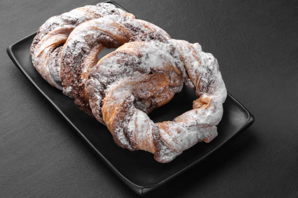 istock Chocolate cookie rings sprinkled with powdered sugar. 2189907657