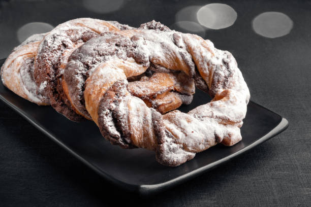 istock Chocolate cookie rings sprinkled with powdered sugar. 2189907700