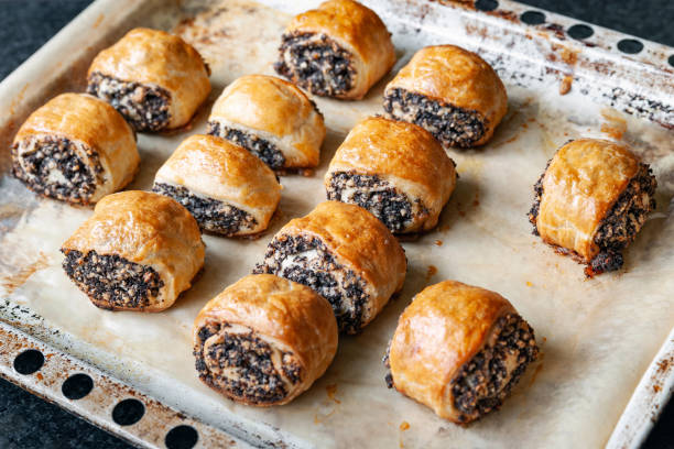 istock Crispy freshly baked cookies with poppy seeds on a baking tray. 2189907743