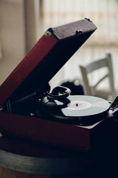 istock Red record player with a black needle sits on a wooden table 2189908362