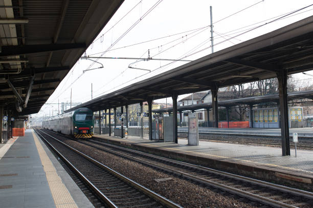 istock Train is sitting on the tracks at a train station 2189908377