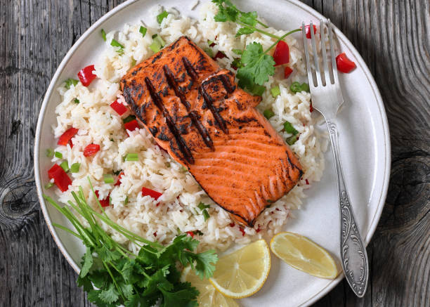 istock grilled red salmon fillet with rice, top view 2189914656