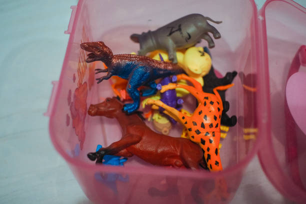 istock animal toys in a container, good for background 2189915534