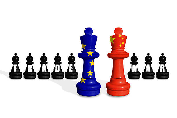 istock Chess made from EU and China flags on a white background with word TRADE WAR 2189916362
