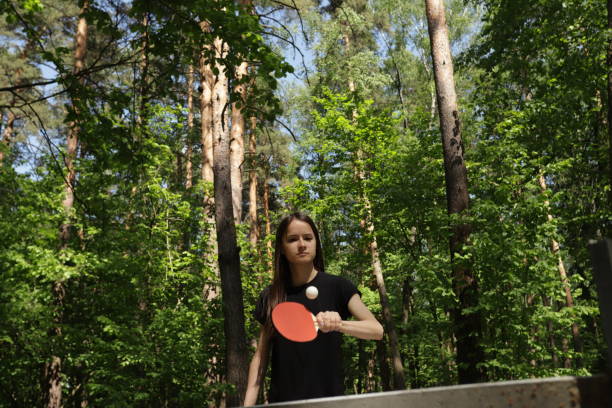 istock Ping pong player, participating in a friendly game, having fun with a paddle and ball as a hobby. 2189924233