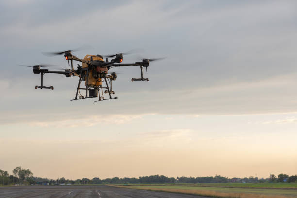 istock Agricultural drones and agricultural crops, Drones to spray fertilizer in rice fields. Agriculture drone flying above young rice fields to spraying fertilizer and pesticide farmland agricultural 2189925115