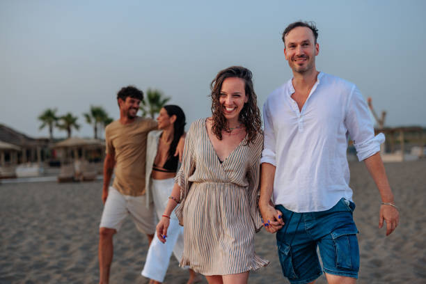 istock Couple holding hands at the beach 2189926979