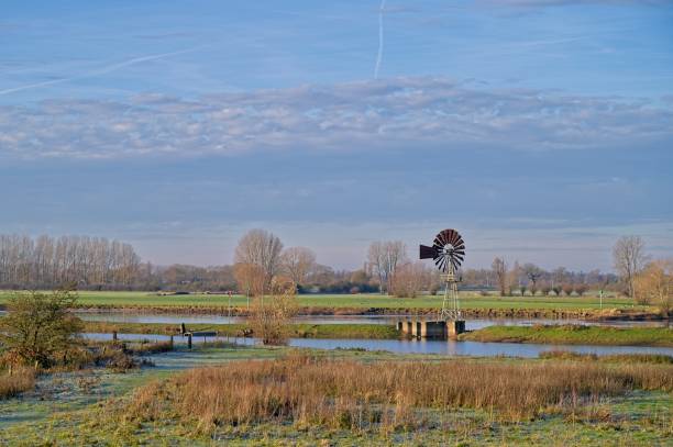 istock An old iron windmill along the river IJssel. 2189929122