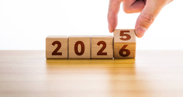istock Hand flipping block 2025 to 2026 on table 2189929139