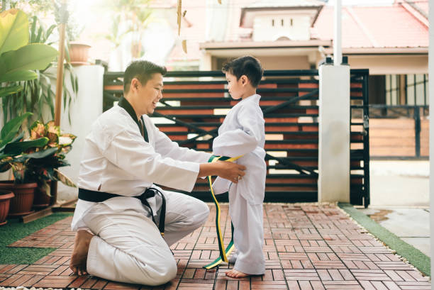 istock Children preparing for martial art with father 2189929846