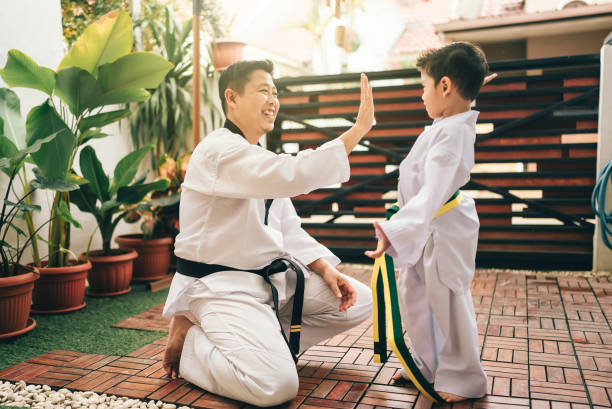 istock Children preparing for martial art with father 2189929871