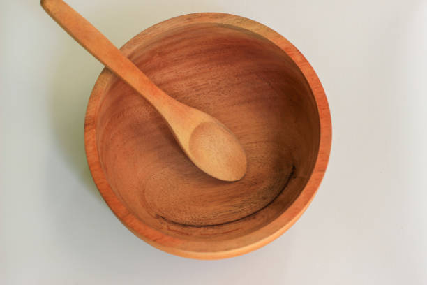 Empty wooden bowl and spoon