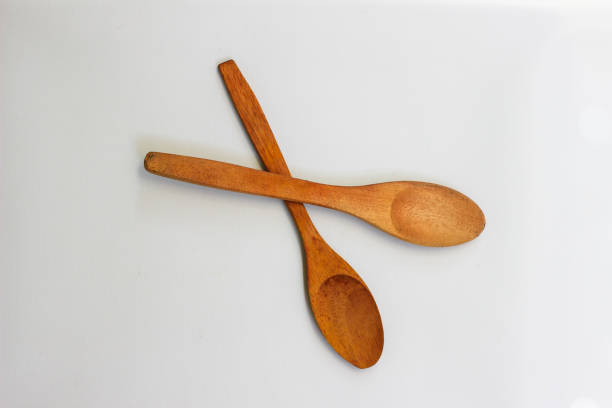 Old Used Wooedn Spoon Cut Out on White.