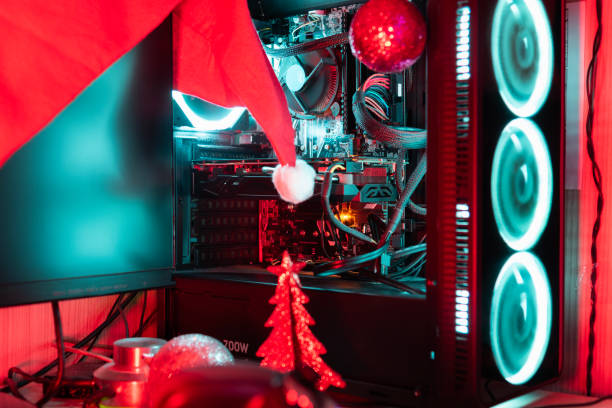 istock Computer case with RGB lights surrounded by Christmas decorations 2189932200