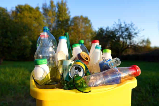 istock Bottles in Waste container. Waste sorting for Recycling. Glass bottle in trash bin container. 2189932573