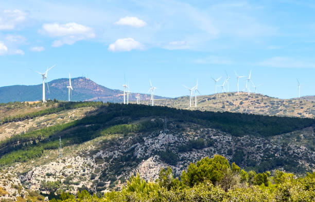 istock Wind farm, Wind energy, electricity. Wind turbine in mountains. Eolic park windpower. 2189933872