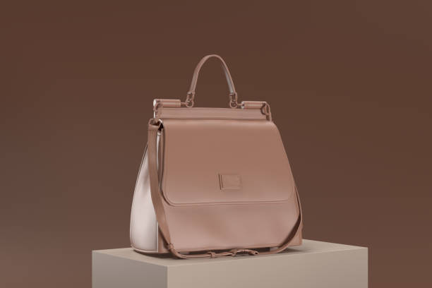 istock A brown purse with a gold chain strap sits on a brown surface 2189934168