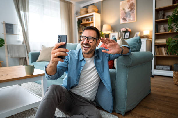 istock Man having a video call at home 2189935825