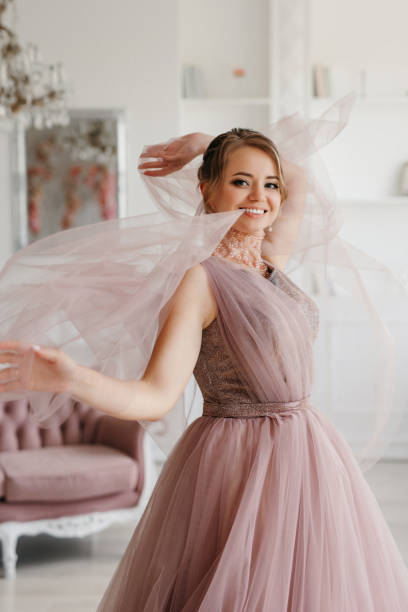 istock bride in lavender fluffy wedding dress in bright studio 2189937427