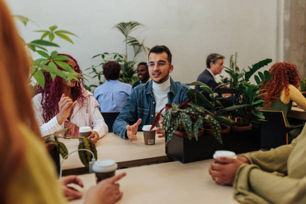 istock Young man leading brainstorming session in modern green office 2189940910
