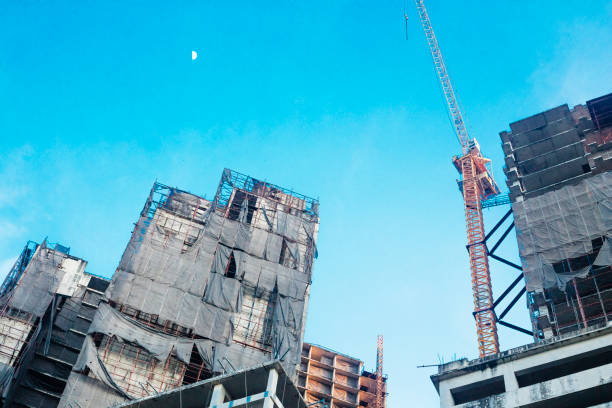 Recife, Pernambuco, Brazil - September 03, 2022:Brazilian men working on a building in Boa Viagem residential district.