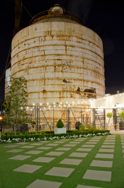 Waco, TX/USA - March 8, 2018: Magnolia Market and The Silos in downtown Waco, Texas have revitalized business here.  They are closed for the day, but lit up at night.