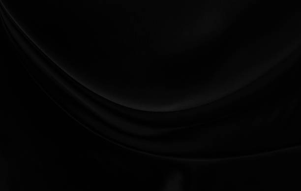 istock Black gray satin dark fabric texture luxurious shiny that is abstract silk cloth background with patterns soft waves blur beautiful. 2189952312