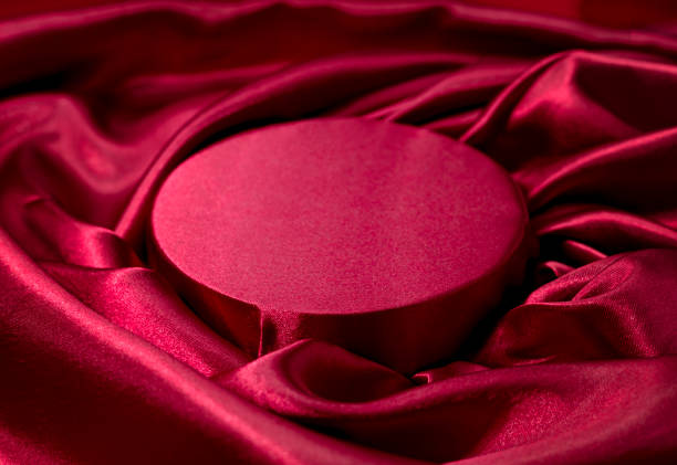 istock Silk satin round stage, elegant background. Red podium, product promotion backdrop.Textile decoration, texture.presentation display. 2189955076