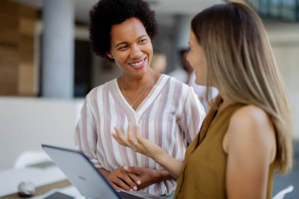 istock Diverse Female Professionals Working Together on Laptop in Office 2189956951