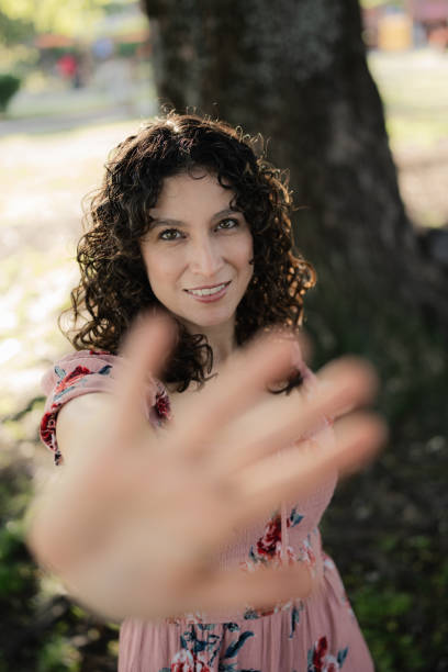 istock Woman making stop sign with hand in park 2189958127