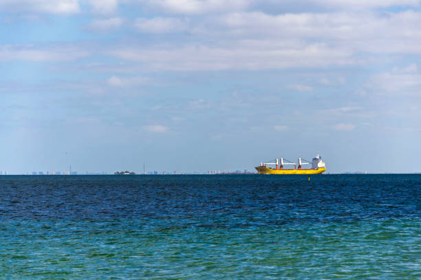 Container ship on sea with copy space on heaven and water, sunny day
