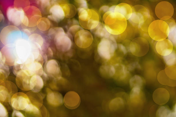 istock Abstract autumn background with blurred round highlights, bokeh effect yellow, orange, dark pink. Change of summer season to autumn, decrease in temperature, mood. Blank, template for artwork 2189961395