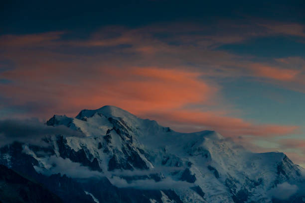 Mont Blanc, Monte Bianco mountain summit in the Alps. The highest mountain in Europe. Snow and glacier covered high altitude snow mountain in the Alps. The top of Montblanc Chamonix valley landscape