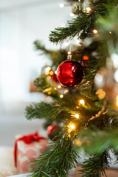 istock Festive Red Ornaments on Cozy Office Christmas Tree 2189962490